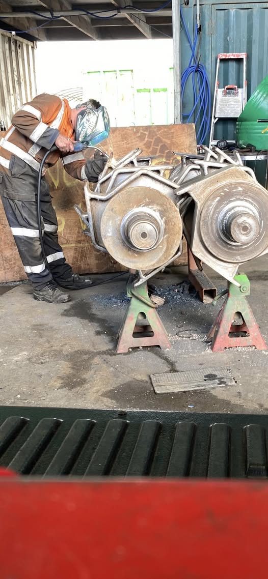 Blake welding steel plates on site, sparks flying